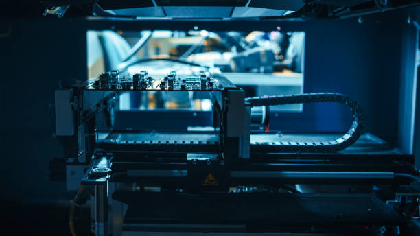 istock Automated Robotic Industrial Equipment is Testing Electronic Printed Circuit Board with Light and Laser Technology After Assembly. 1145276379