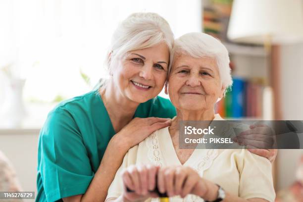 Home Caregiver And Senior Adult Woman Stock Photo - Download Image Now - Senior Adult, Healthcare Worker, Home Caregiver