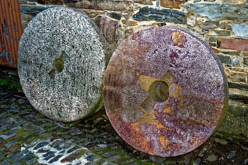 Photo of two stones that were used for milling grain in a mill