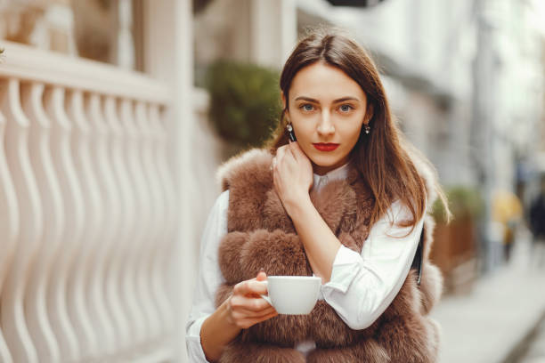 istock Beautiful girl drinks coffee 1145279719