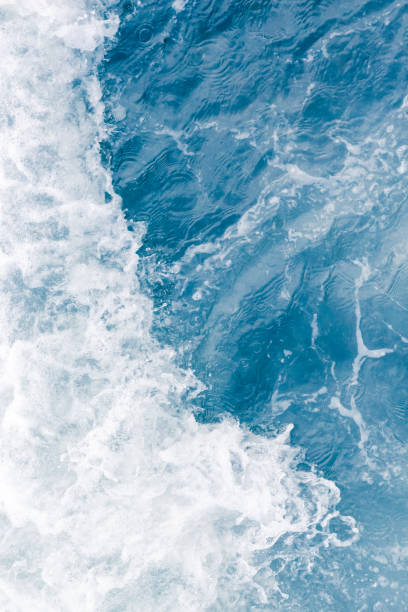 istock Pale blue sea wave during high summer tide 1145281769