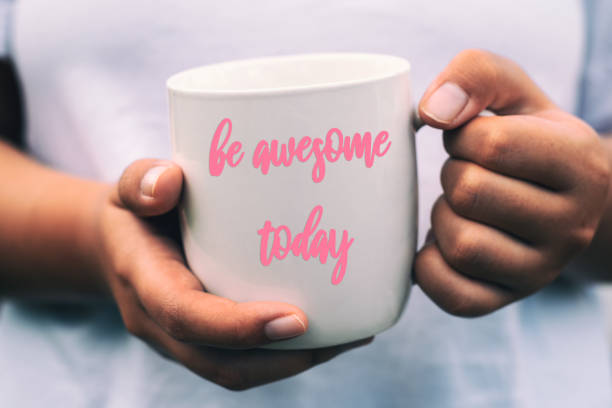 istock Hand holding cup of coffee with Inspirational quotes - 1145281805
