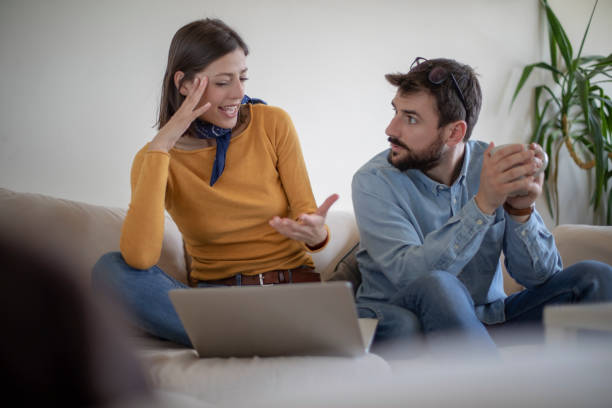 istock Young married couple in the living room with a computer 1145281915