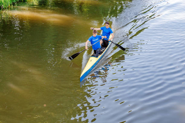 Leipzig, Germany - May 21, 2018: young sportsmen rowing and training on a sunny day at river in Leipzig