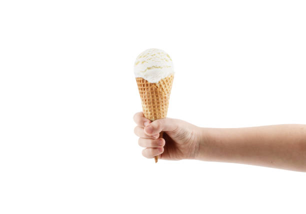 hand holding vanilla ice cream with cone isolated on white background stock photo