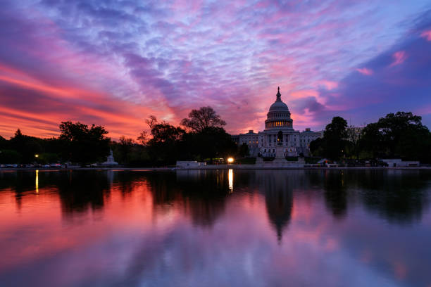 istock Capitol building with reflection in reflecting pool at sunrise, Washington DC 1145285033