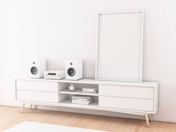 istock Vertical Frame poster Mockup standing on white tv console with hi fi audio system 1145286441