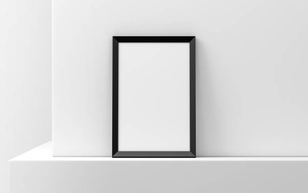 istock Black Wooden Frame with Poster Mockup standing against white wall 1145287173