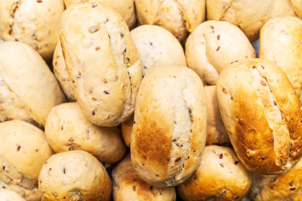 istock Baked oat white bread buns. Food, bakery concept 1145287426