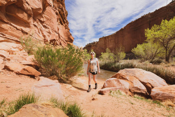 istock Young Woman Enjoying Hiking by Water 1145289956