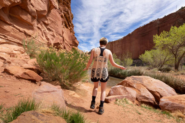 istock Young Woman Enjoying Hiking by Water 1145289987