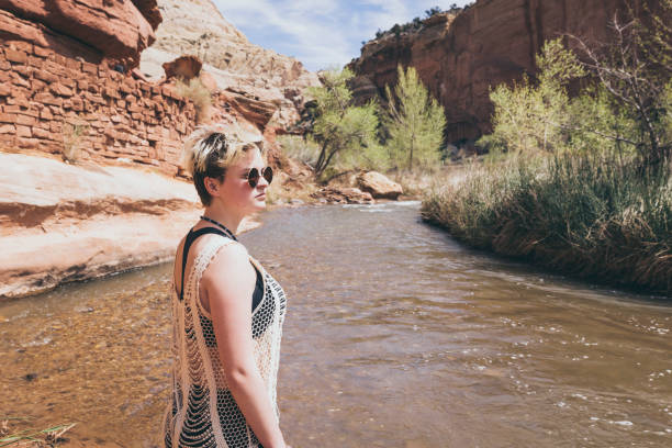 istock Young Woman Enjoying Hiking by Water 1145290055
