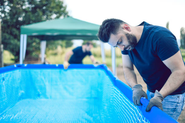 istock Handsome Male Technician Ensuring Pool Safety 1145290930