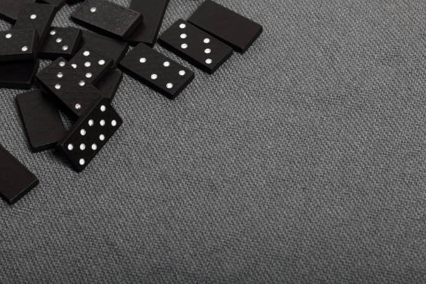 istock Domino knuckles on a surface covered with a coarse gray cloth. 1145292275
