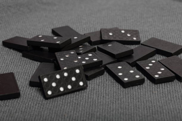 istock Domino knuckles on a surface covered with a coarse gray cloth. 1145292277