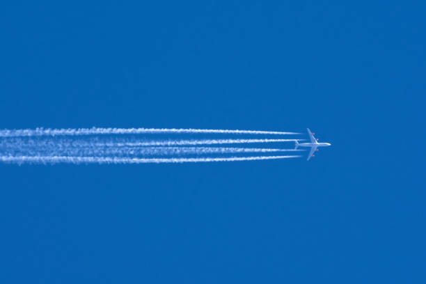 istock Airplanes leaving contrail trace on a clear blue sky. 1145292460