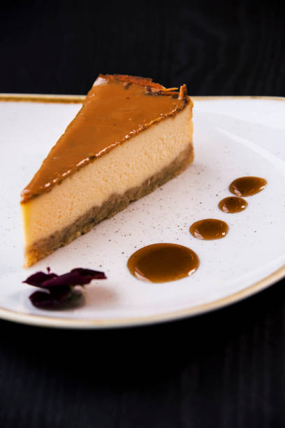 istock Caramel cheesecake on a trendy plate with caramel sauce. 1145293591