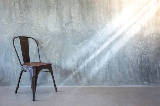 istock chair on Bare cement wall detail object 1145293797