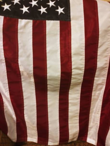 istock American flag drapped over a chair 1145296311