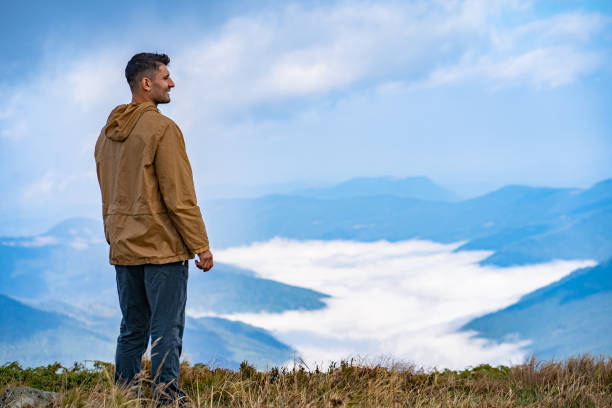 istock The man standing on the mountain landscape background 1145301150