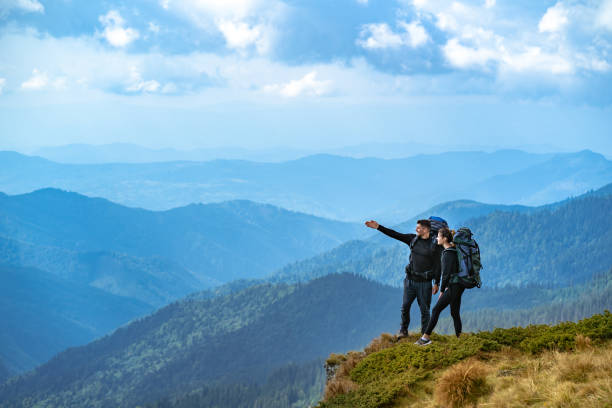 istock The happy couple gesturing on the cliff 1145303137