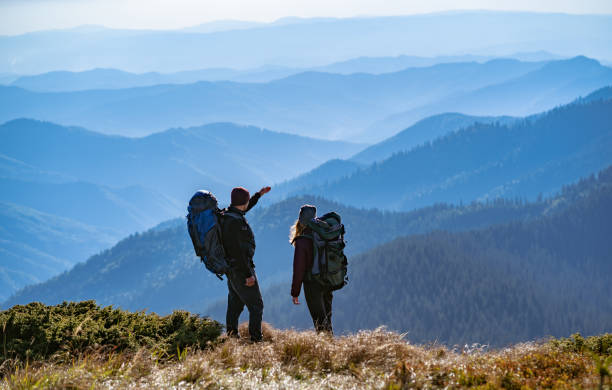 istock The couple gesturing on the mountain with a beautiful view 1145304338