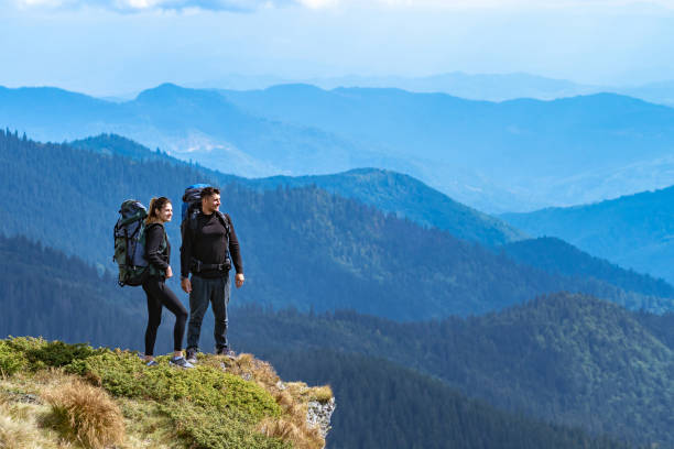 istock The happy couple standing on the cliff 1145304803