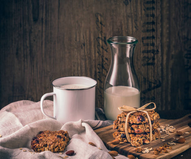 Tasty homemade oat flapjacks with  milk and nuts stock photo