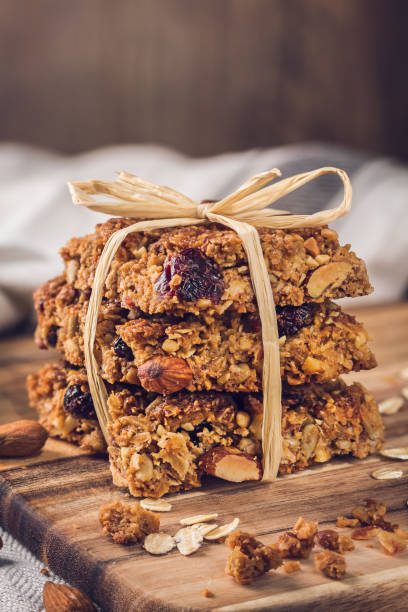 Tasty homemade oat flapjacks on a wooden board stock photo