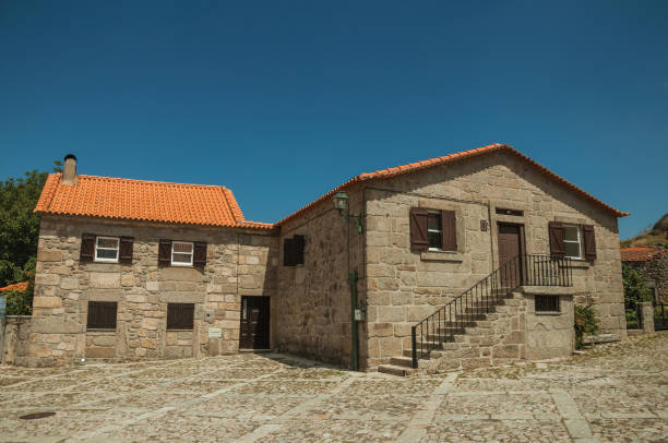 istock Old stone house and staircase on cobblestone alley 1145314227