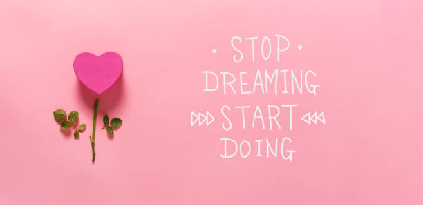 istock Stop dreaming start doing message with heart flower 1145315041
