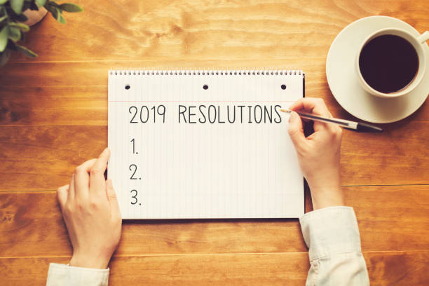 istock 2019 Resolutions with a person holding a pen 1145315533