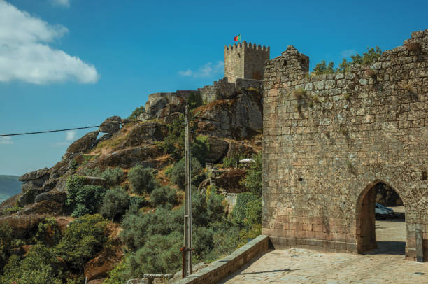 istock Stone wall with gateway and tower over cliff 1145315569