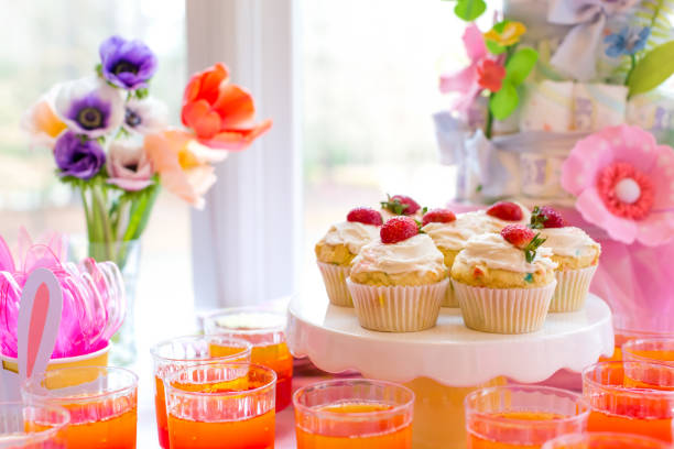 istock Dessert table with cupcakes and flowers 1145315751
