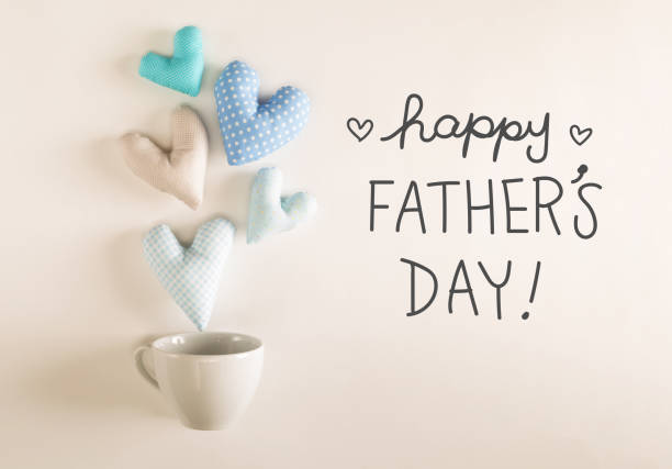 istock Father's Day message with blue heart cushions 1145315778