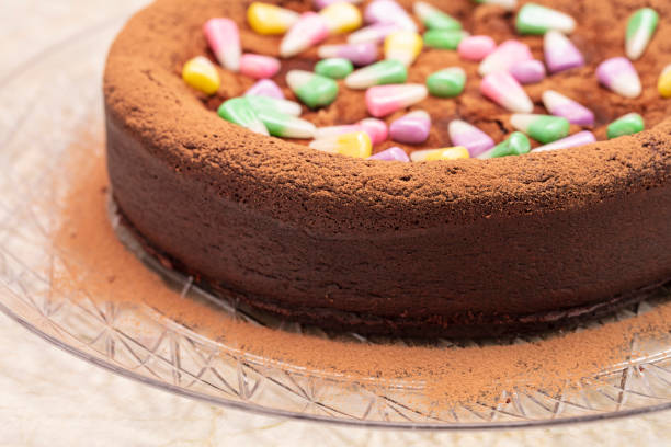 istock Dark Chocolate Flourless Cake With Candy Corn Topping 1145317347