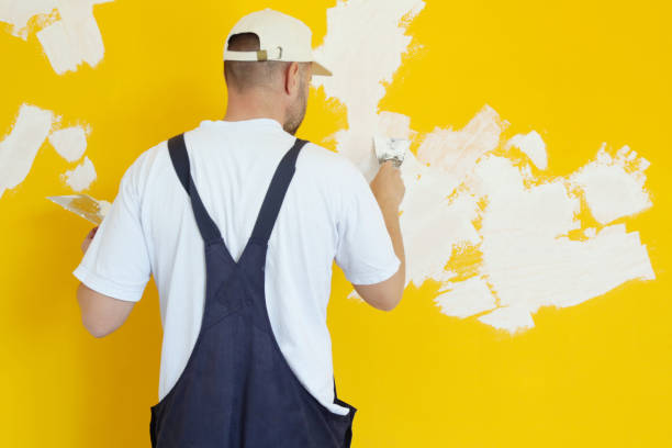 istock Man plastering wall with putty-knife, close up image. Fixing wall surface and preparation for painting. 1145318539