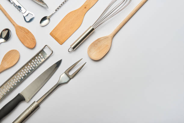 istock flat lay with metal and wooden cooking utensils on grey background 1145321721