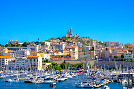 Marseille embankment with yachts and boats in the Old Port and Notre Dame de la Garde., Vieux-Port de Marseille.