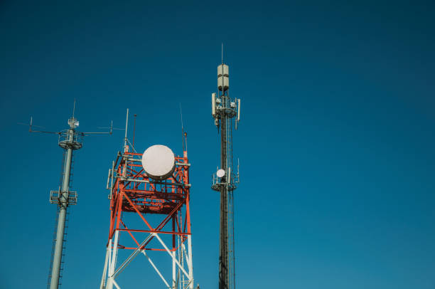 istock Telecommunication towers with antennas and blue sky 1145332273