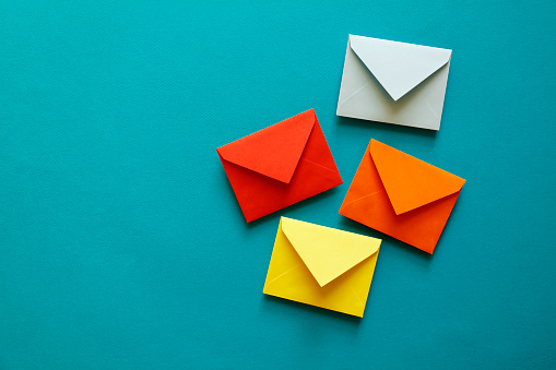 Four multi-coloured envelopes