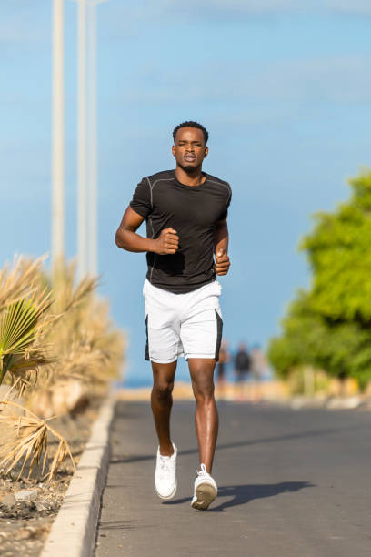 istock Black african american young man running outdoor 1145345018