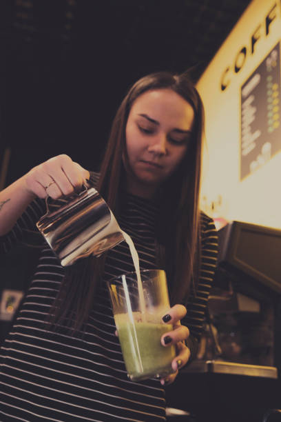 barista is making a coffee