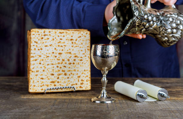 Pesach Passover symbols of great Jewish holiday. Traditional matzoh plate Pesach Passover symbols of great Jewish holiday traditional matzah and kosher wine in glass. passover celebration stock pictures, royalty-free photos & images