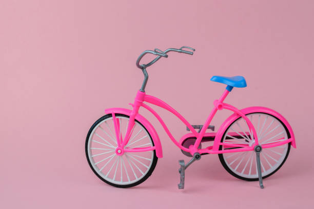 istock Red bike with blue saddle on pink background. 1145374137