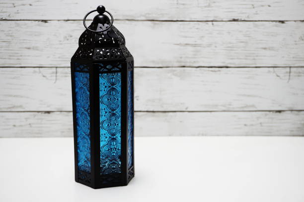 istock moroccan style metal lantern with space on wooden background 1145374207