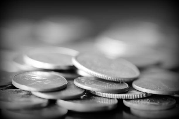 istock American cents on a dark background close up. Black amd white 1145377672