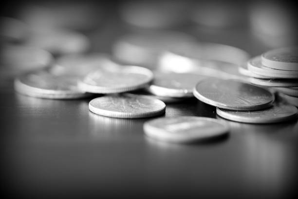 istock American cents on a dark background close up. Black amd white 1145377674