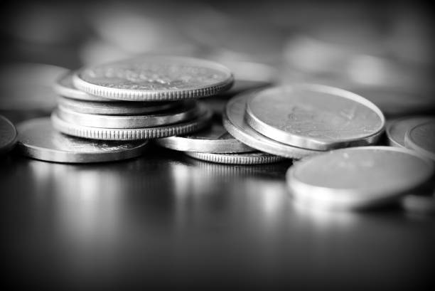 istock American cents on a dark background close up. Black amd white 1145377677