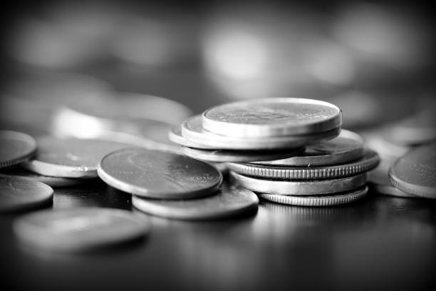 istock American cents on a dark background close up. Black amd white 1145377679